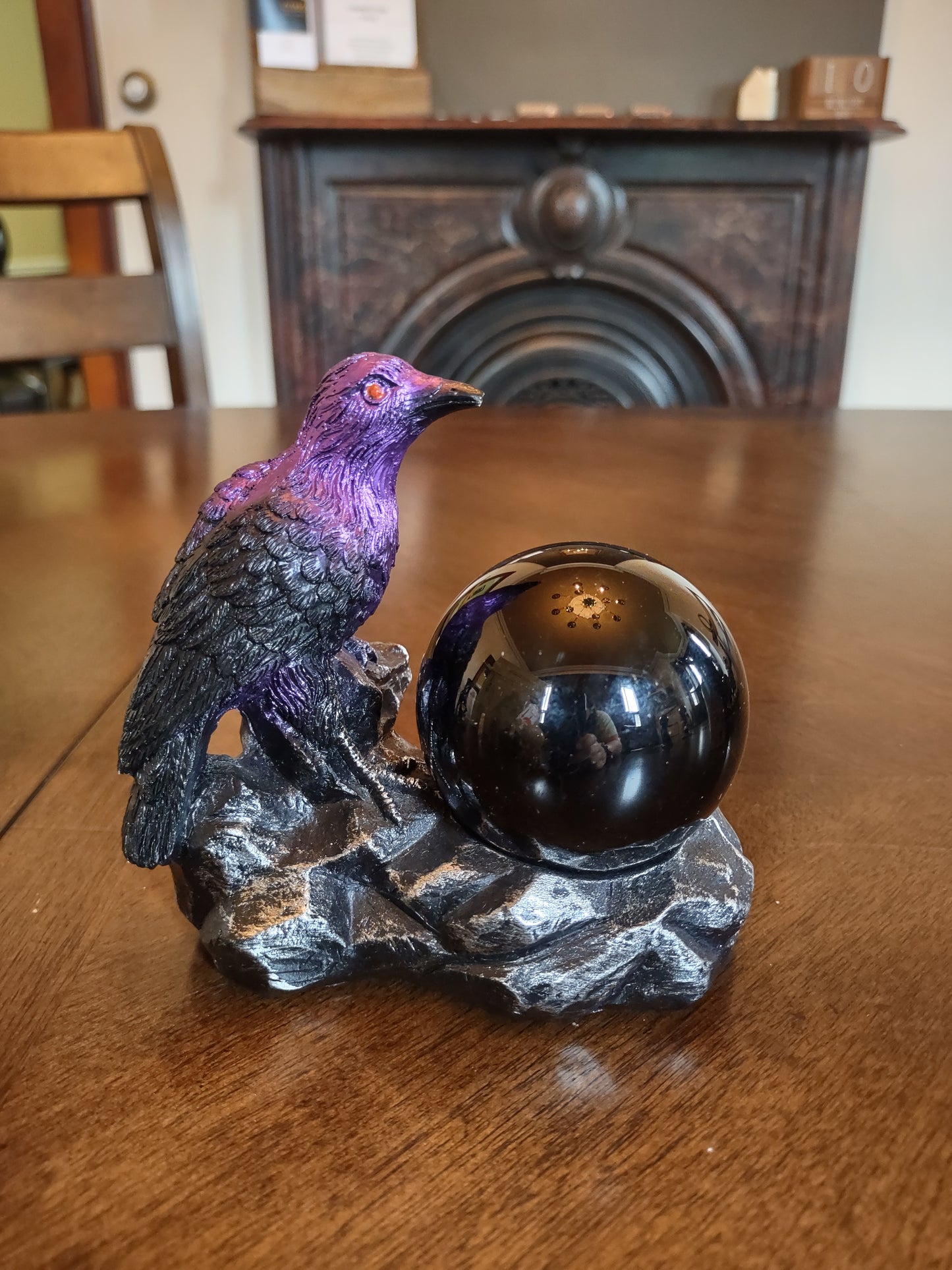 Raven sphere holder with black obsidian sphere